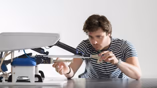 Biomedical Engineering student working on the development of a medical device.