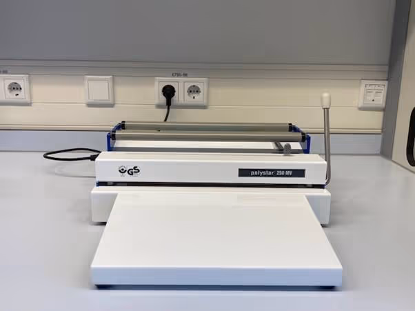 A white machine with a black cordAI-generated content may be incorrect.