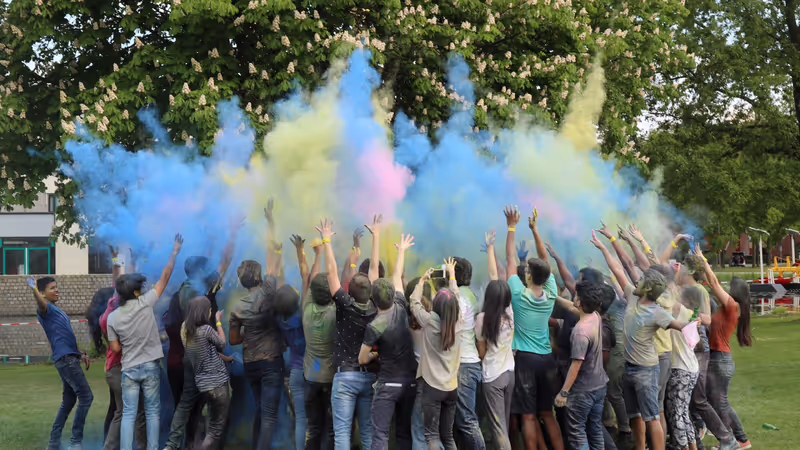 Students celebrating the Holi Festival of Colour on campus.