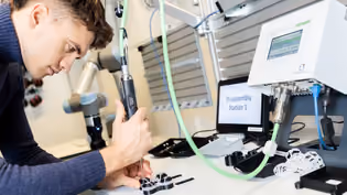 Disassembly station in industrial setting, showcasing automation and circular design principles in sustainable manufacturing.