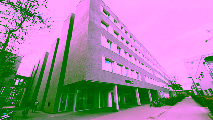 A picture of a modern looking grey building called Ravelijn