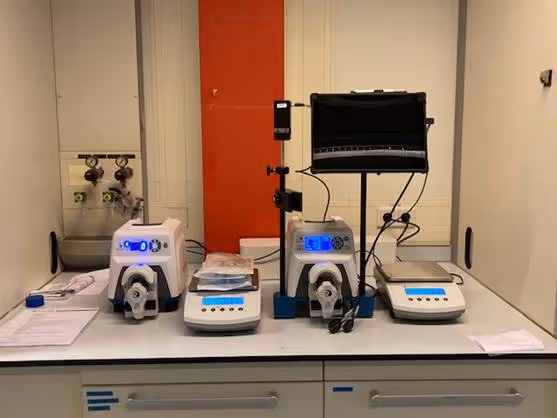 A table with several machines on itAI-generated content may be incorrect.