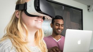 Two students trying out VR-glasses