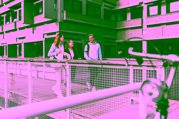 Persons walking in front of Cubicus building