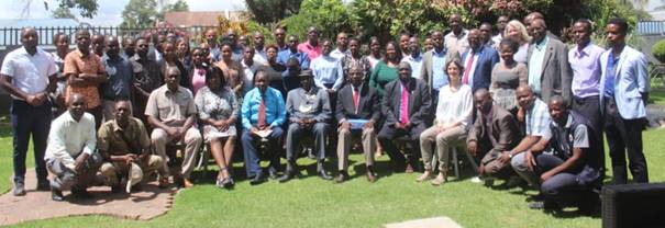 A group of people sitting on grass

AI-generated content may be incorrect.
