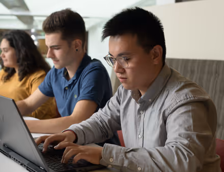 Boy working on his laptop