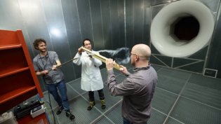 Wind tunnel test with smoke visualization, demonstrating aerodynamic analysis and experimental methods in mechanical engineering.