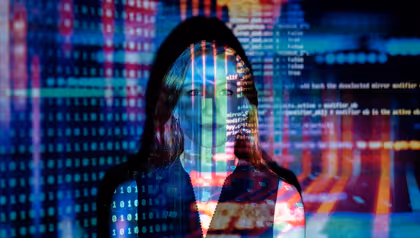 University of Twente researcher with projected digital code, symbolising human and inclusive artificial intelligence