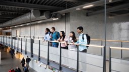 students on a bridge in a high school building