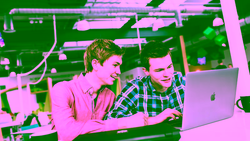 Two students working on a business plan for a start-up.