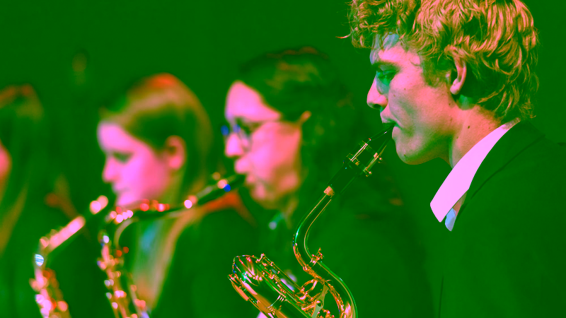 Members of the student orchestra play a song.