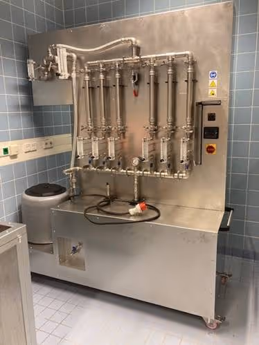 A machine with pipes and valvesAI-generated content may be incorrect.