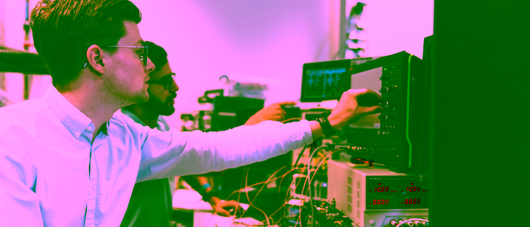 Students measuring signals with an oscilloscope