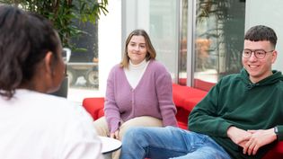 Three Psychology students sitting and talking