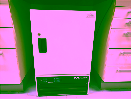 A white refrigerator with a black handleAI-generated content may be incorrect.