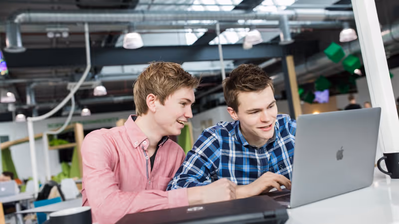 Two students working on a business plan for a start-up.