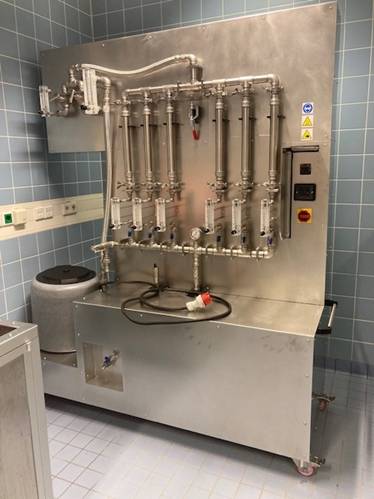 A machine with pipes and valvesAI-generated content may be incorrect.