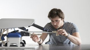Biomedical Engineering student working on the development of a medical device.