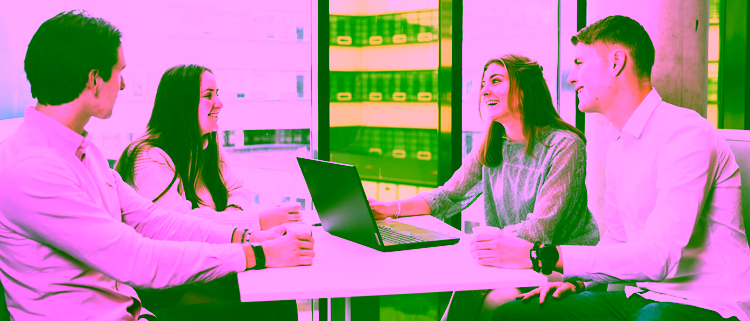 Four students working together in a group project