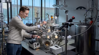 Student operates a high-tech setup for materials research in the nanolab.